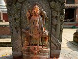 Kathmandu Changu Narayan 30 Four Armed Vishnu Stands On Garuda Behind A Headless Statue In The North East Corner Of Changu Narayan A four armed Vishnu stands on Garuda in the north east corner of Changu Narayan. Vishnu arms hold the disc, mace / club, conch shell, and lotus.